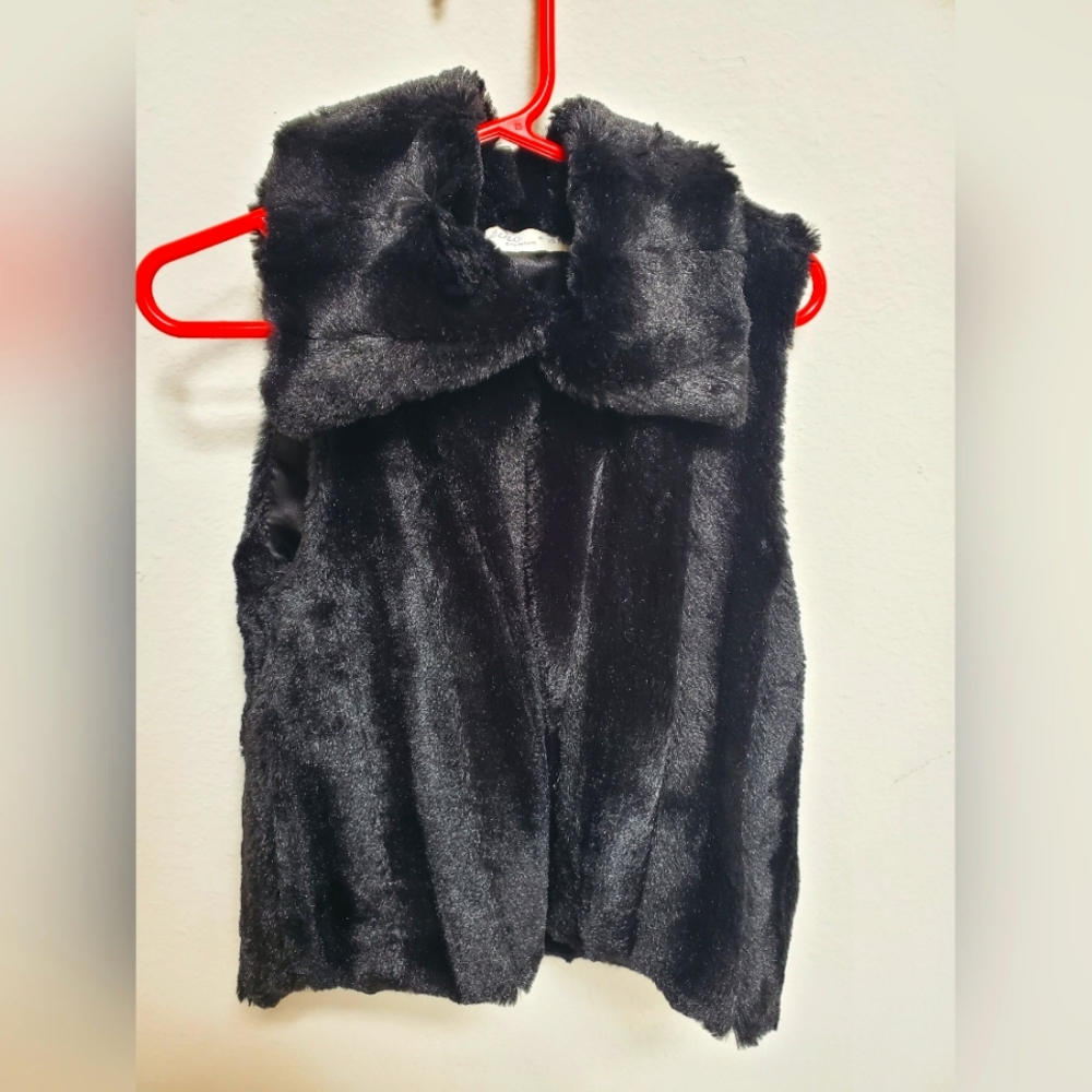 Black and fluffy vest